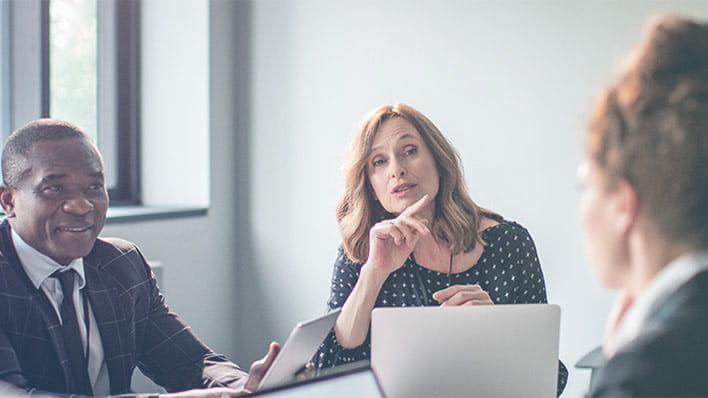 Three people in a meeting