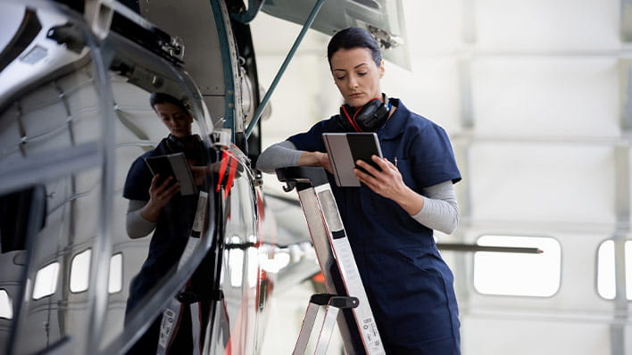 Person inspecting aircraft
